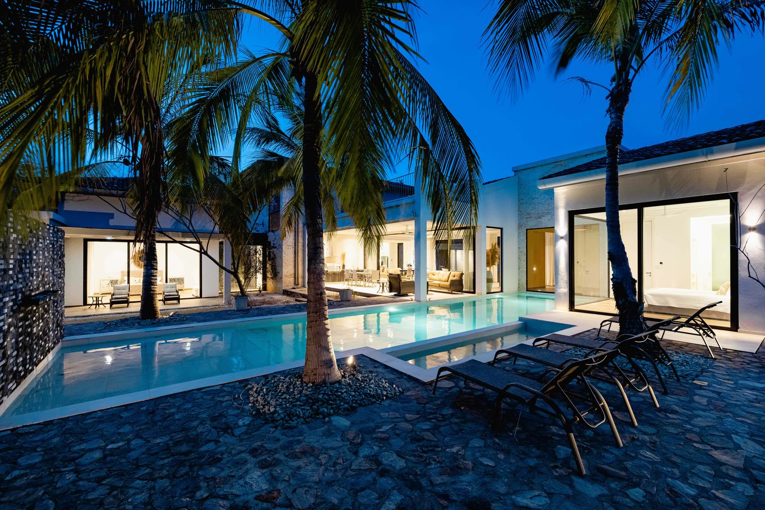 An open-air living room in a Guanacaste house, prepared and empty